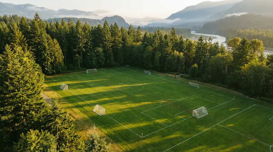 Youth soccer teams practicing on a well-maintained field